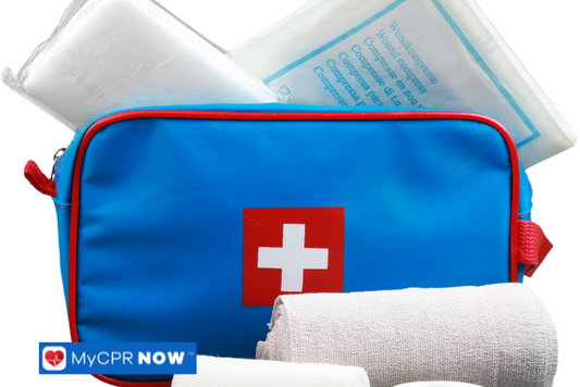 A blue first aid kit displayed with bandages and medical materials.