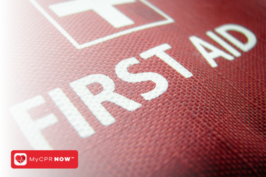 A close up of a red first aid kit. 