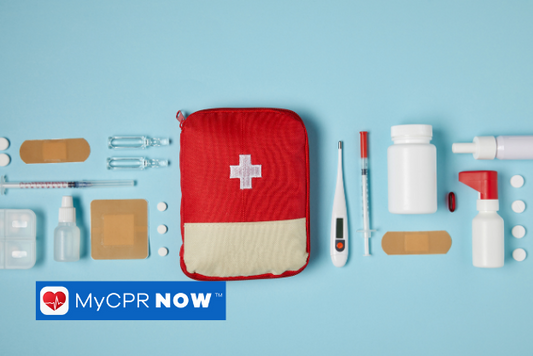 A centered, red first aid kit with first aid suppolies on either side on a light blue background. 