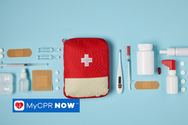 A red first aid kit with first aid supplies, such as a thermometer, pill bottle, pills, bandages, and a syringe, on either side on a blue background. 