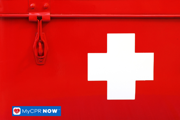 Close-up of red first aid box with white cross symbol.