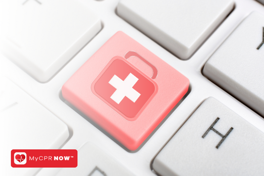 A close up of computer keys, one red with a symbol of a first aid kit. 