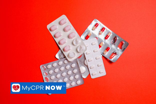 Several blister packs of pills on a red background