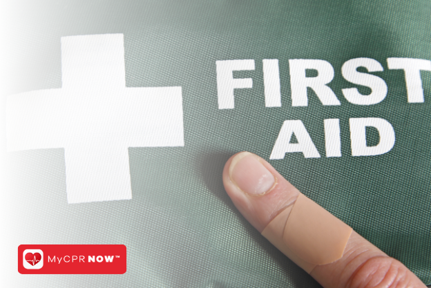 A finger with a bandage on it pointing to a green first aid kit. 