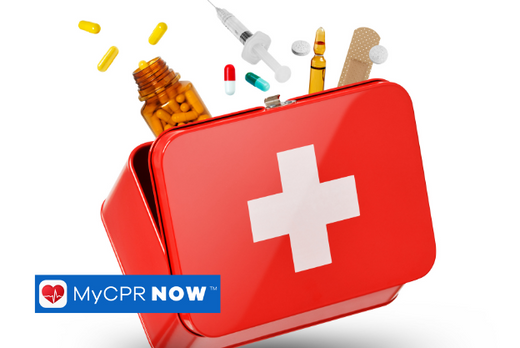 A red open first aid kit on a white background with pills a syringe and an adhesive bandage coming out of it. 