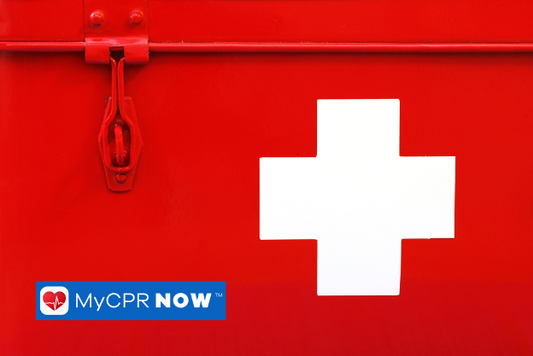 A close up of  red first aid kit with a white cross on it.