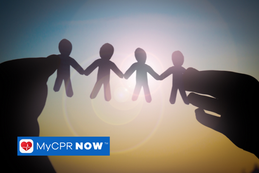 Someone holding a paper doll chain up to the sunlight. 