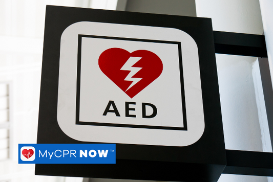 A red, black, and white AED sign. 