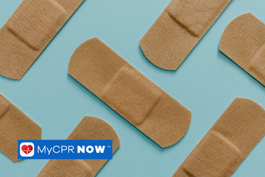 A pattern of adhesive bandages against a blue background.