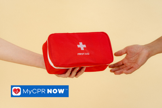 A hand holding a red first aid kit handing it to a reached out hand on a light yellow background. 