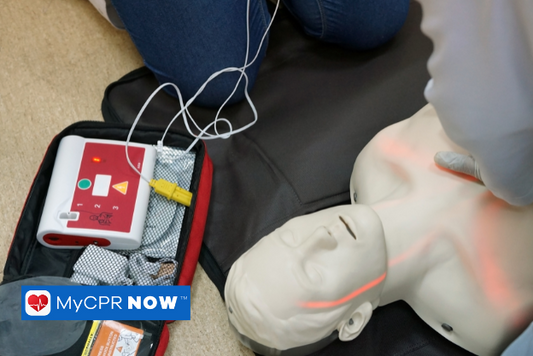 AED placement and BLS training being conducted on a training manikin 